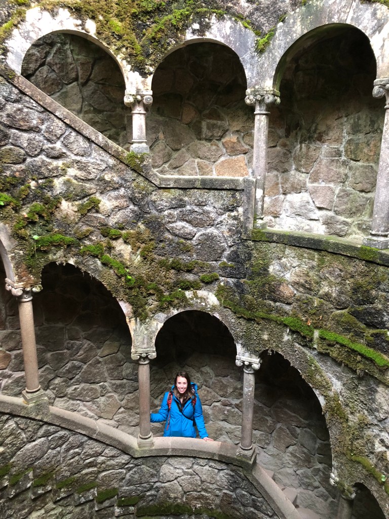Woman Standing in Initiation Well in Quinta da Regaleira Sintra Portugal