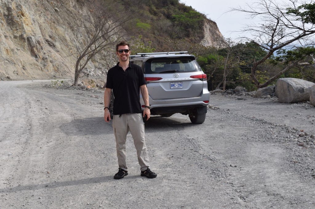 Man standing in front of Toyota Fortuna in Costa Rica
